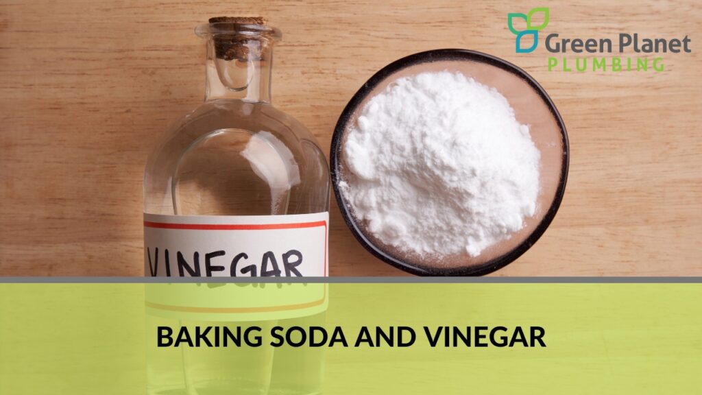 Vinegar in a bottle and baking soda in a bowl